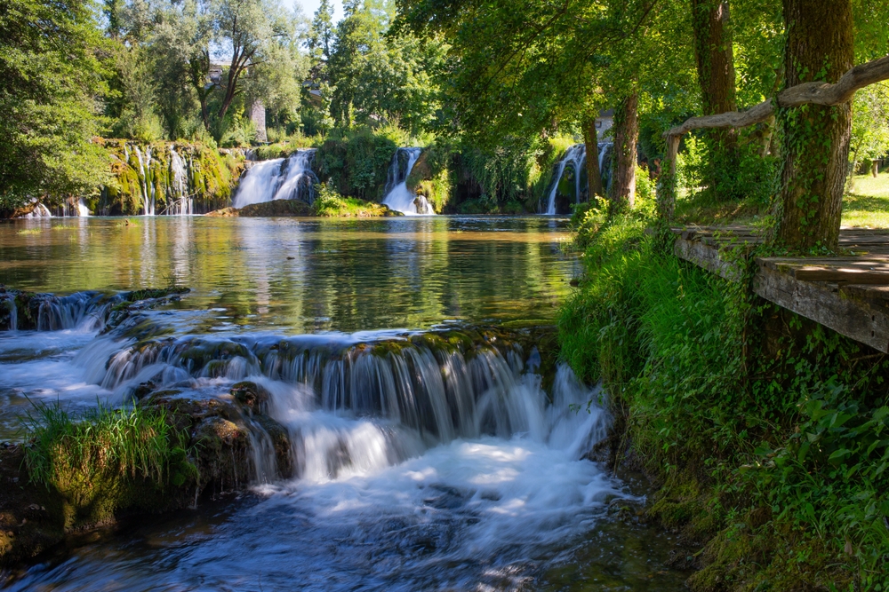 Rastoke village waterfalls flowing through traditional houses - scenic Croatia waterfall destination
